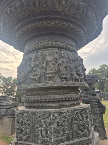 Another photograph of the same recorded subject. Rows of figures and fine patterned bands wrap around a rounded column. The upper and lower ends extend beyond the available views.