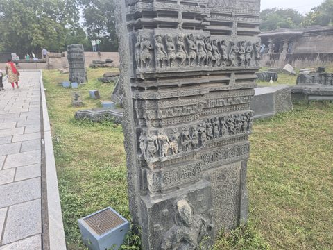 Multiple rows of figures and ornament cross a tall architectural piece. A larger figure appears on the lower section.